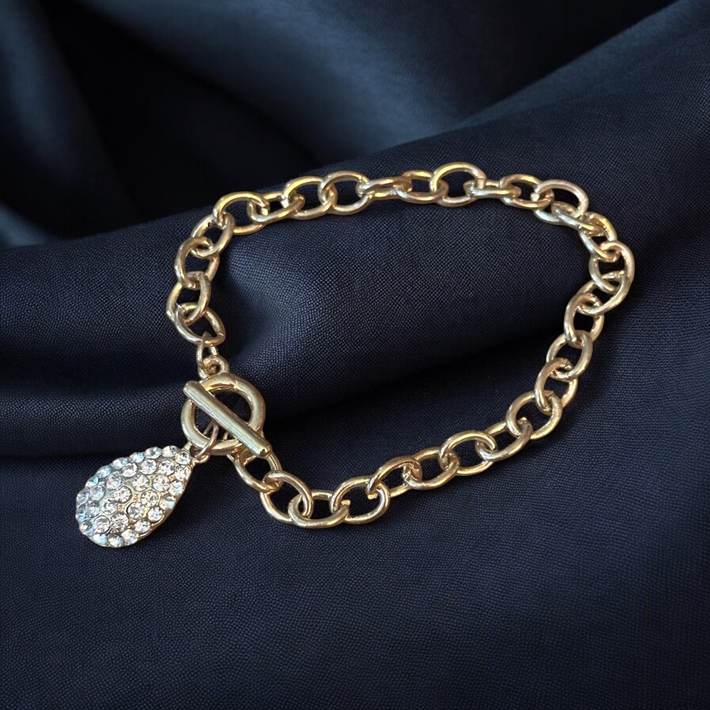 Gold tone pave teardrop charm toggle bracelet